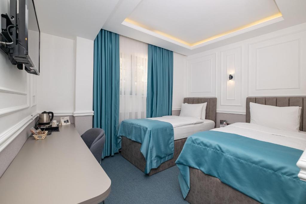 Postel nebo postele na pokoji v ubytování Askadar May Otel
