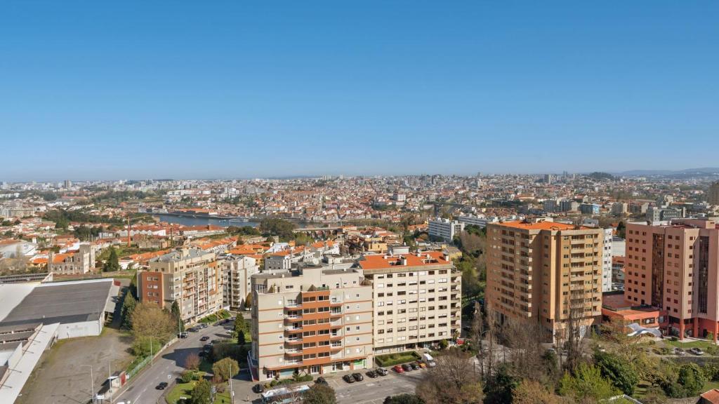 an aerial view of a city with tall buildings at Holiday Inn Porto Gaia by IHG in Vila Nova de Gaia