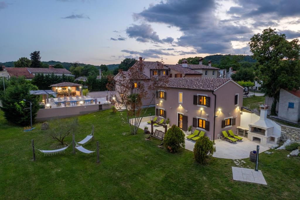 an aerial view of a large house with a yard at Villa Vesna with tennis court in Pićan