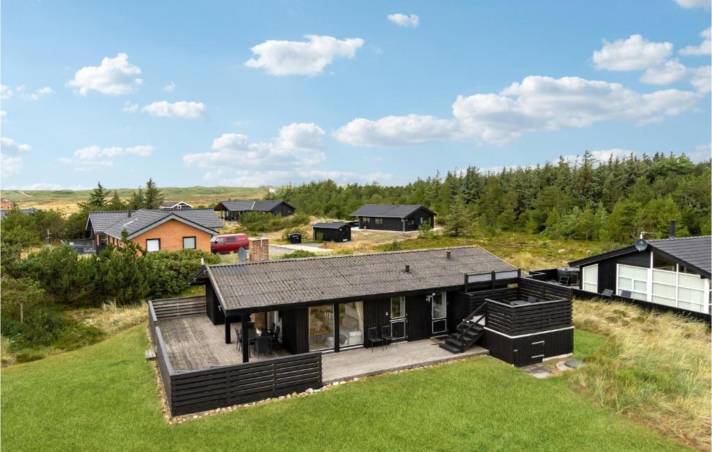 an aerial view of a house with a yard at 3 Bedroom Lovely Home In Hvide Sande in Bjerregård