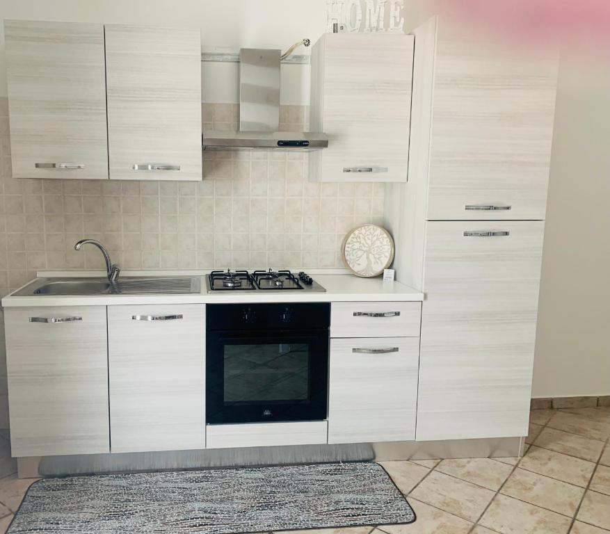 Kuchyň nebo kuchyňský kout v ubytování Il Cortiletto