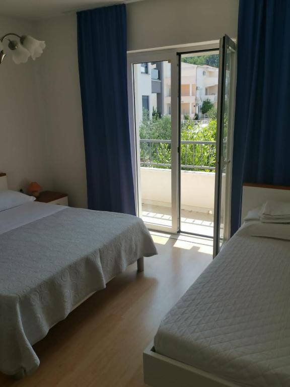 Postel nebo postele na pokoji v ubytování Apartment Nada