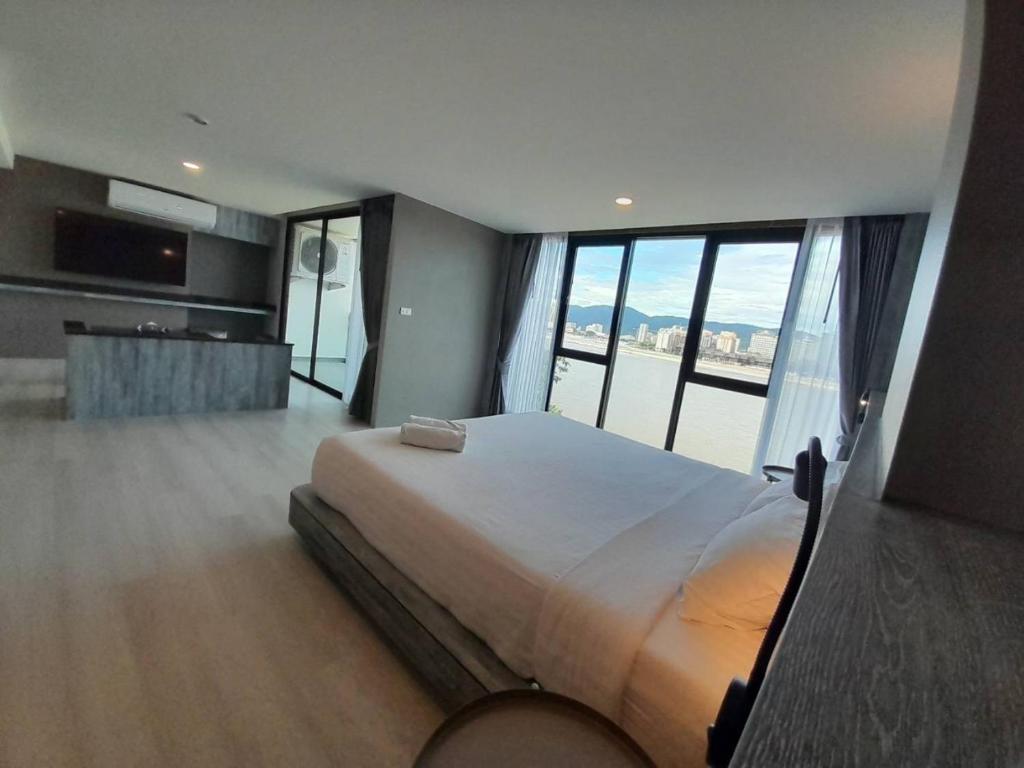 Postel nebo postele na pokoji v ubytování วัน บัดเจท เชียงราย เชียงแสน One Budget Hotel Chiangrai Chiangsaen