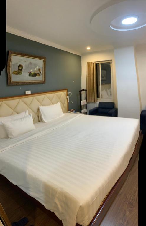 Postel nebo postele na pokoji v ubytování A25 Hotel - 61 Lương Ngọc Quyến