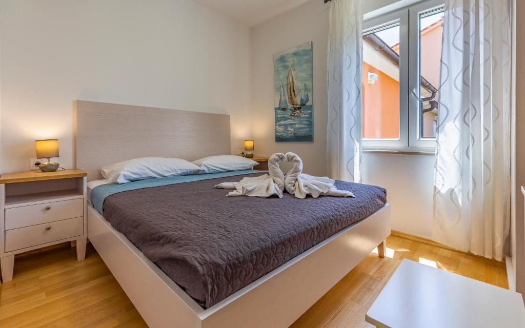 Postel nebo postele na pokoji v ubytování Lotus Villas Resort