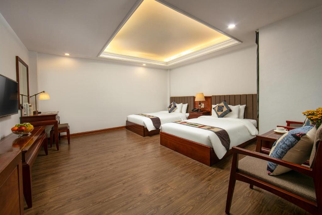 Giường trong phòng chung tại Bamboo Sapa Hotel