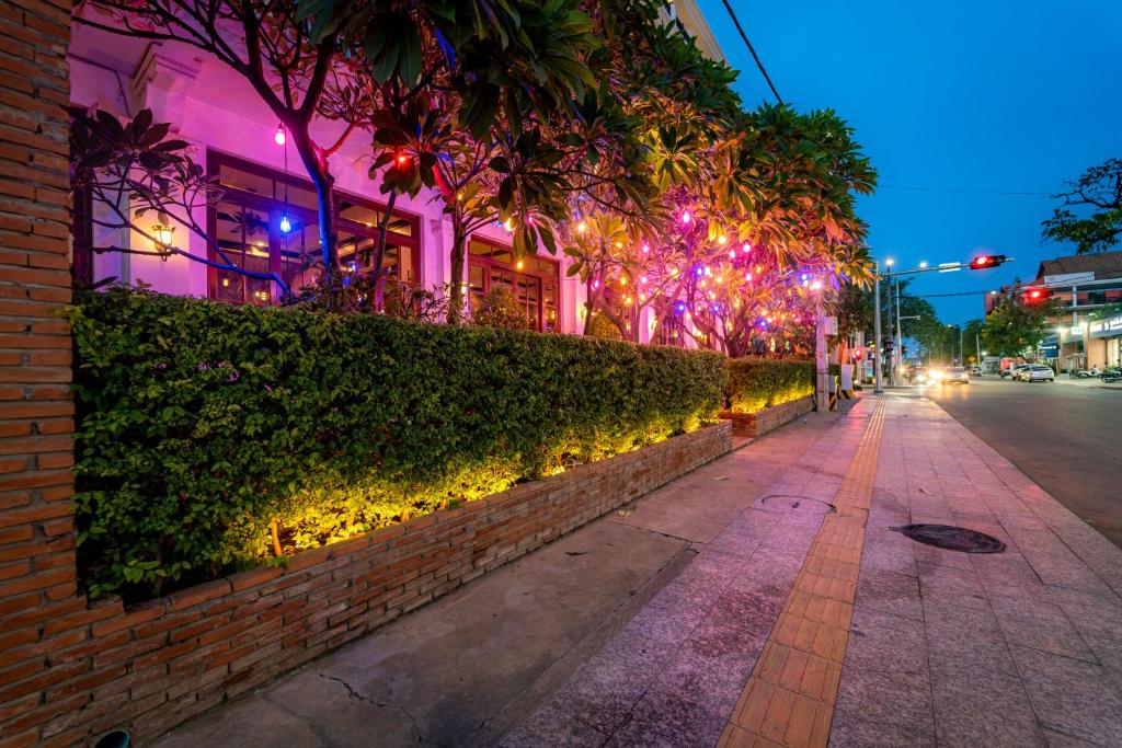 a street at night with lights on a building at Royal Crown Hotel & Spa in Siem Reap