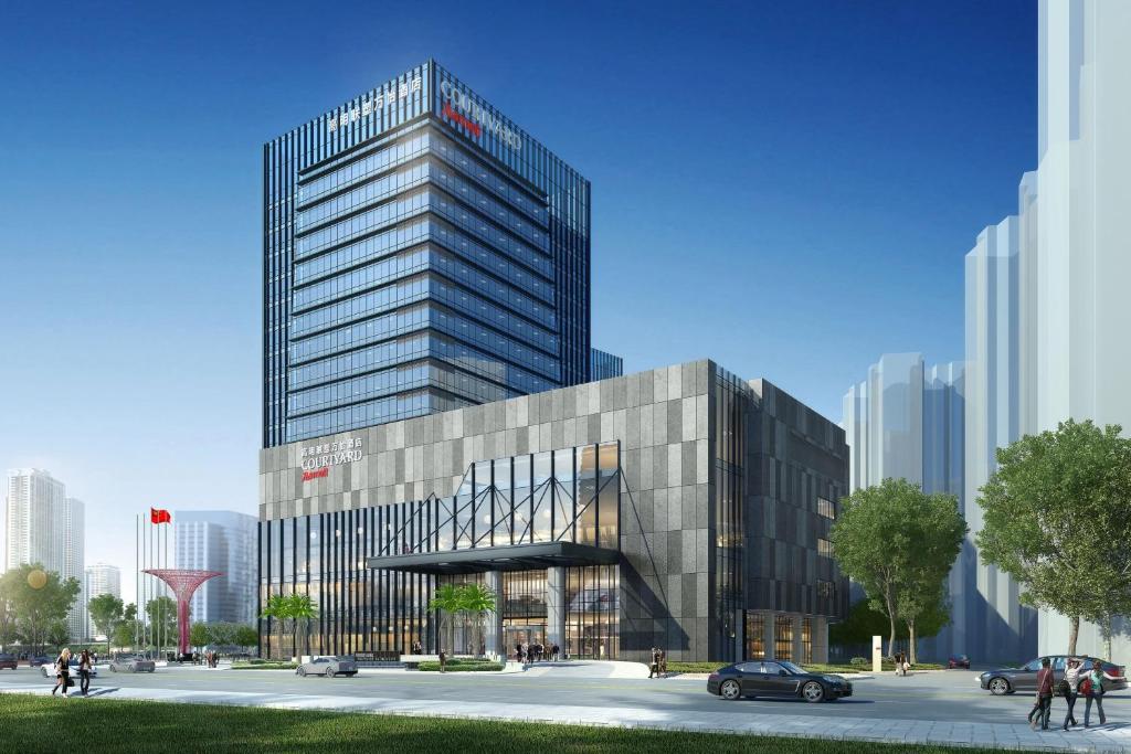 a rendering of a tall building with a car in front at Courtyard by Marriott Foshan Gaoming in Foshan