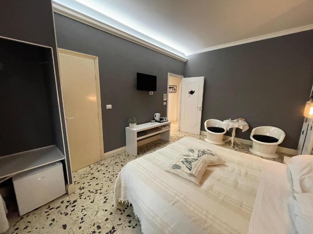 Posteľ alebo postele v izbe v ubytovaní B&B Tiburtina Garden