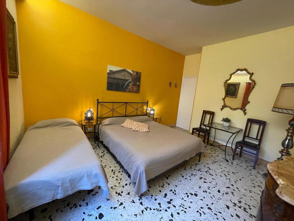 Posteľ alebo postele v izbe v ubytovaní B&B Tiburtina Garden