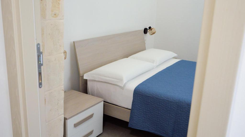 Postel nebo postele na pokoji v ubytování Perla Suite