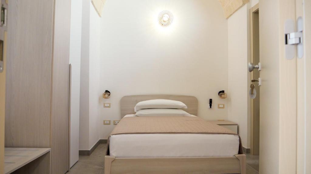 Postel nebo postele na pokoji v ubytování Perla Suite