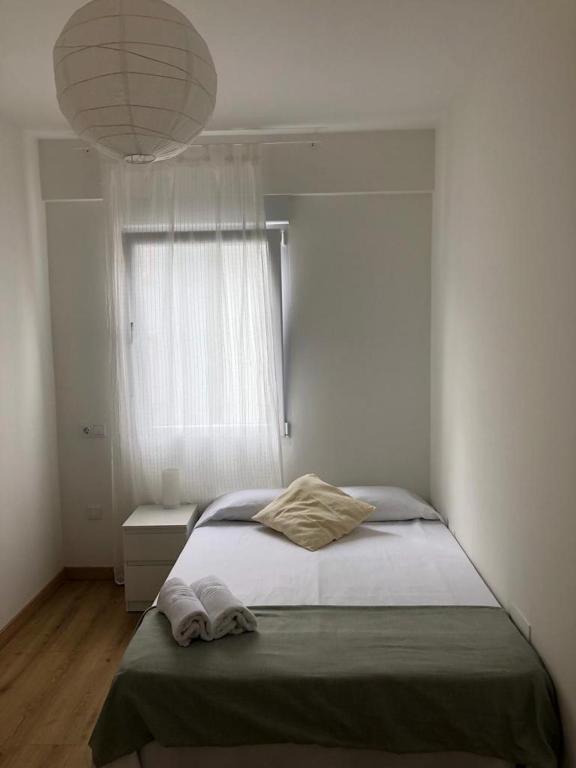 Postel nebo postele na pokoji v ubytování VibesCoruña- Lambre 19-21