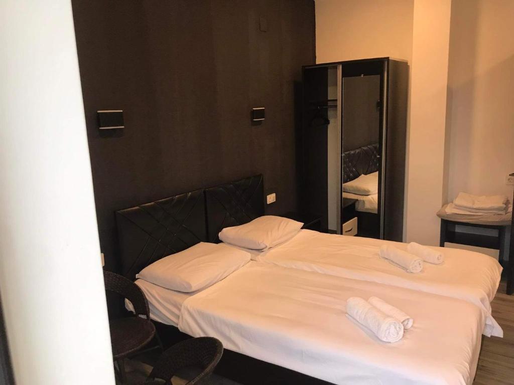 Postel nebo postele na pokoji v ubytování Hotel Niko
