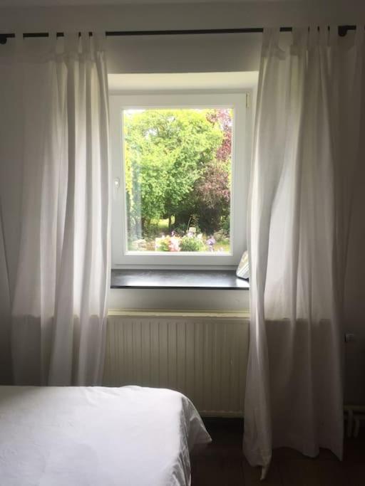 Postel nebo postele na pokoji v ubytování Gîte le tilleul