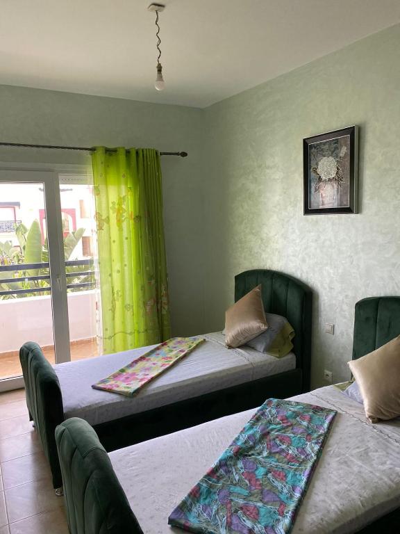 Postel nebo postele na pokoji v ubytování Appartement AP2 Résidence Al Waha