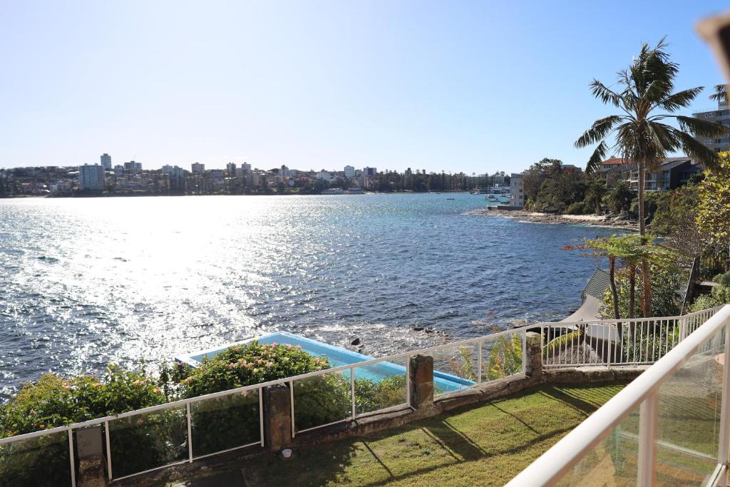 a view of the water from the balcony of a house at Waterfront on Manly Harbour in Sydney