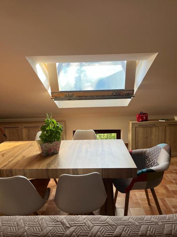 a dining room with a large wooden table and chairs at Il nido in Castel di Sangro