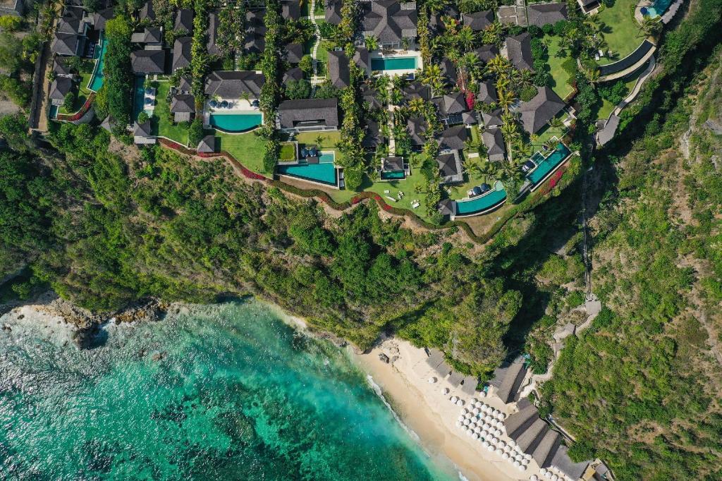 an aerial view of a resort and the ocean at The Ungasan Clifftop Resort in Uluwatu