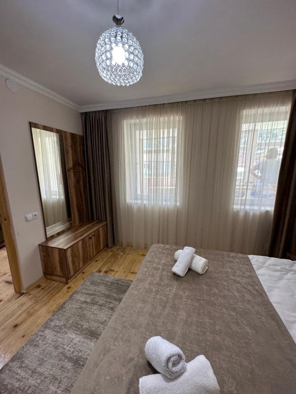 Postel nebo postele na pokoji v ubytování Polaris Kazbegi