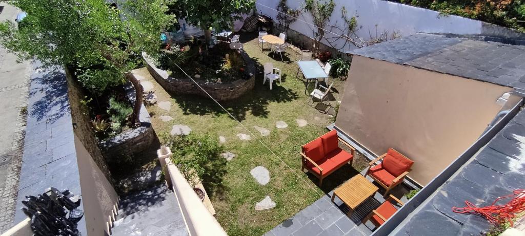 an overhead view of a yard with chairs and a building at HOSTEL NAMOR in Ribadeo