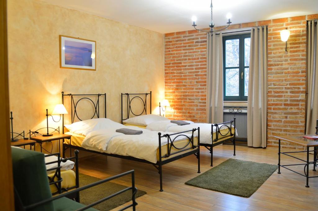 Postel nebo postele na pokoji v ubytování Hotel Via Ironia