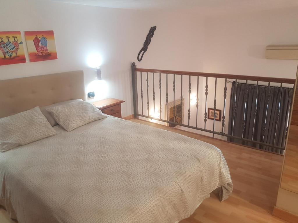 Posteľ alebo postele v izbe v ubytovaní Medano Loft