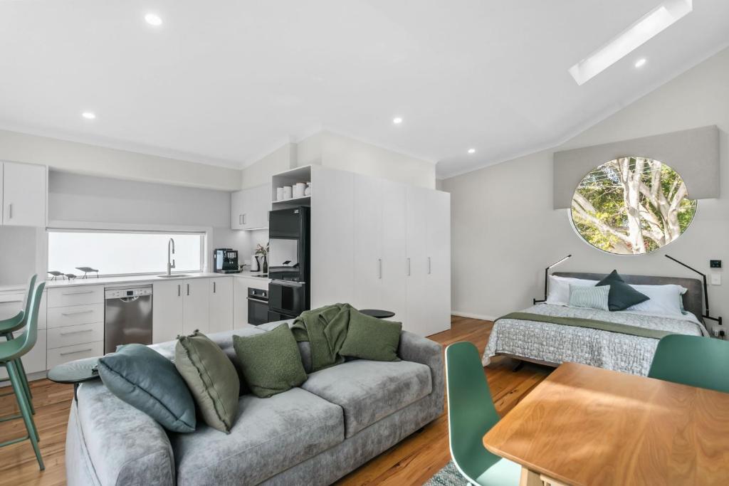 a living room with a couch and a kitchen at WILL56 - Gumtree Studio in Perth