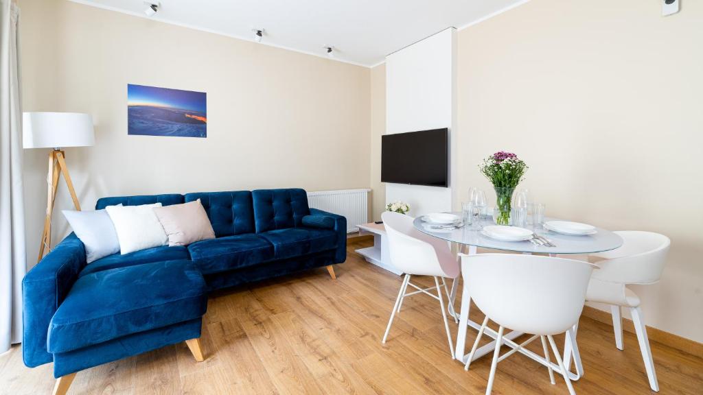 Televízia a/alebo spoločenská miestnosť v ubytovaní Apartamenty Sun & Snow Rezydencja Karkonoska