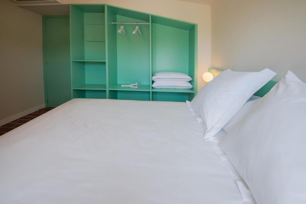 Postel nebo postele na pokoji v ubytování Terra Aurea Aparthotel