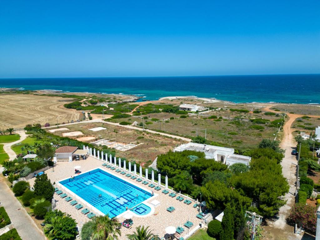 an aerial view of a resort with a swimming pool at Calanca Apulian Residence in Torre Santa Sabina