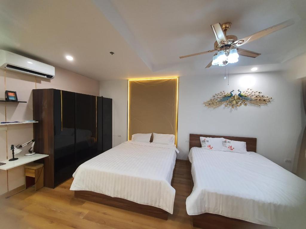 Giường trong phòng chung tại TMS Quy Nhơn Luxury Homestay