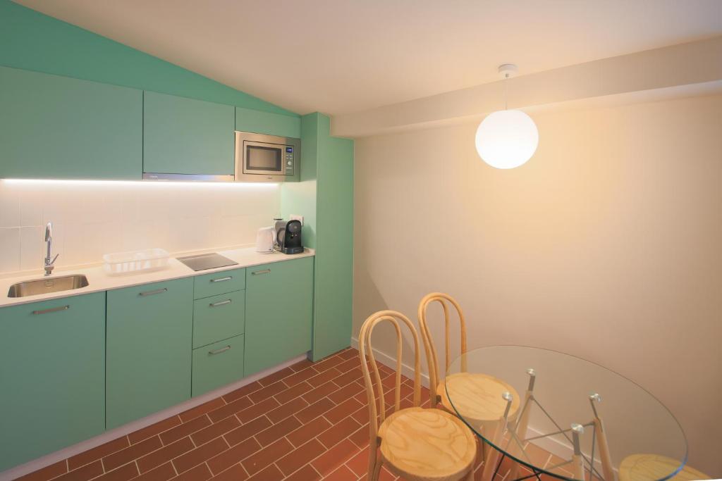 Kuchyň nebo kuchyňský kout v ubytování Terra Aurea Aparthotel