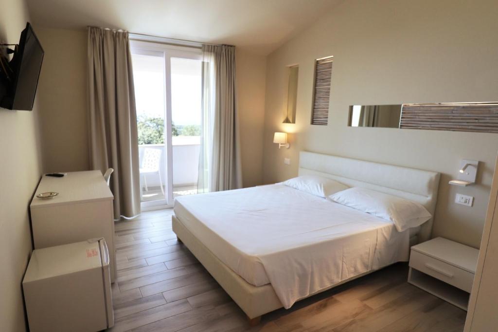 Postel nebo postele na pokoji v ubytování Borgo San Cosmo Tropea