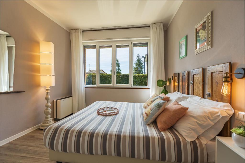 Posteľ alebo postele v izbe v ubytovaní B&B La Cornice