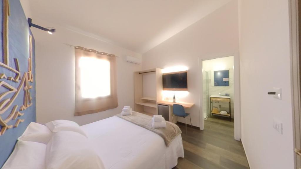 Postel nebo postele na pokoji v ubytování RUDINI' CHARMING ROOM