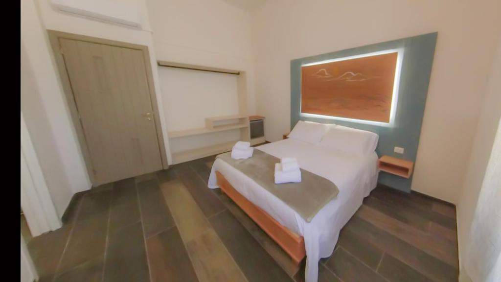Postel nebo postele na pokoji v ubytování RUDINI' CHARMING ROOM