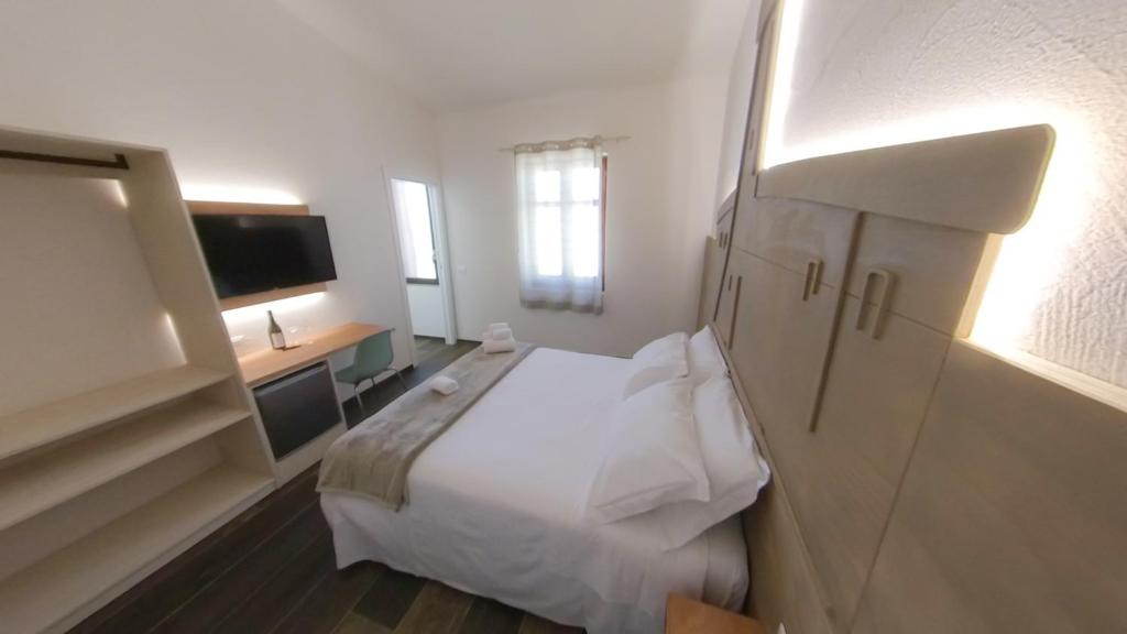 Postel nebo postele na pokoji v ubytování RUDINI' CHARMING ROOM