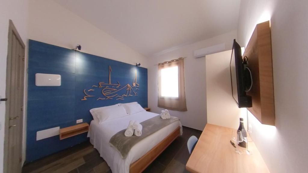 Postel nebo postele na pokoji v ubytování RUDINI' CHARMING ROOM