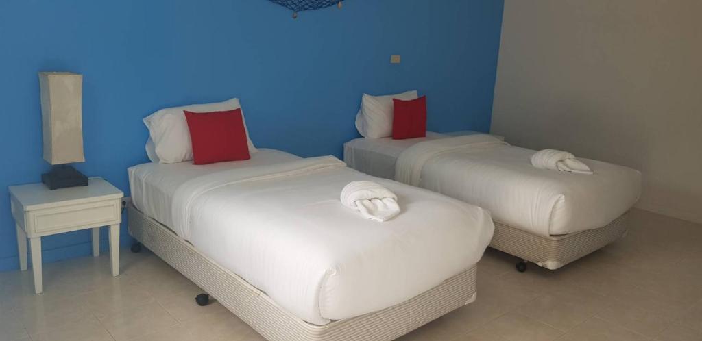 Postel nebo postele na pokoji v ubytování March Samui Resort