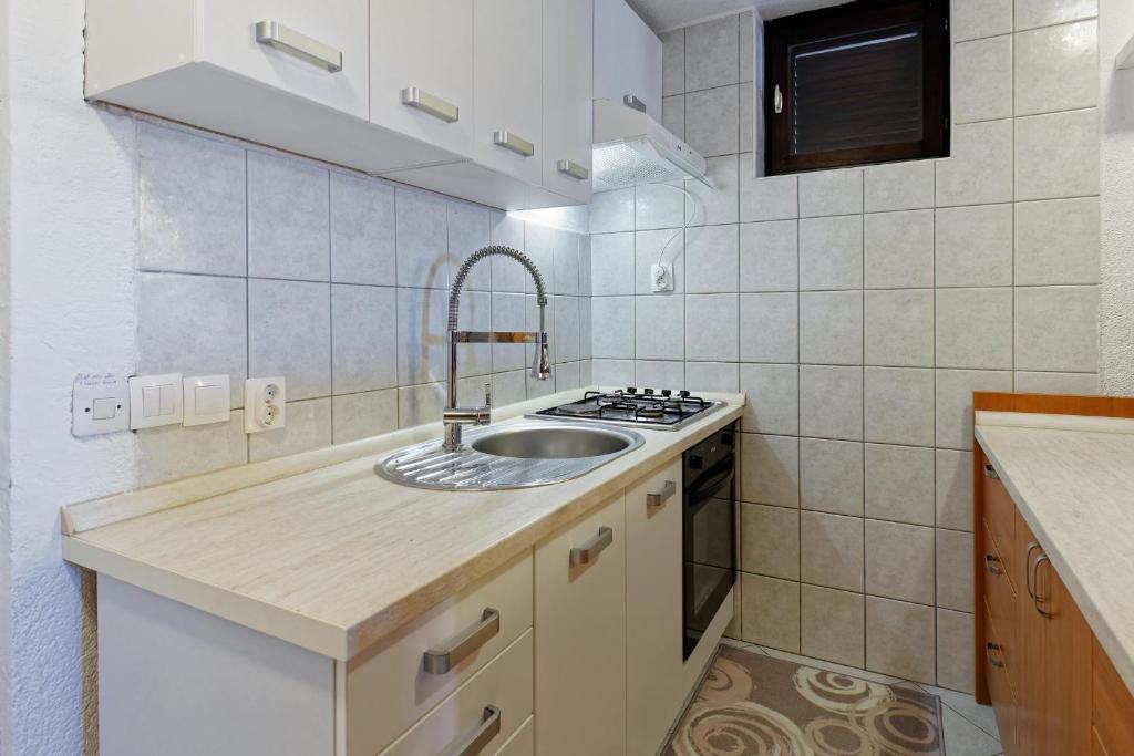 Kuchyň nebo kuchyňský kout v ubytování Apartment Chiara