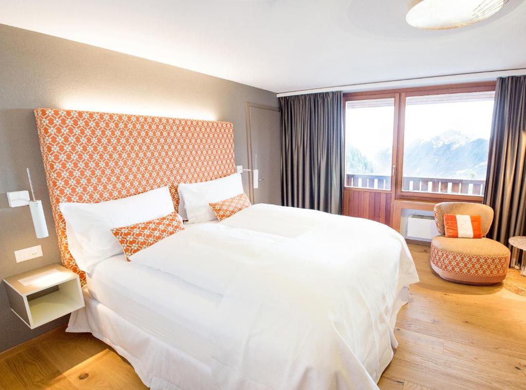 Voodi või voodid majutusasutuse Wellness Hotel Stoos toas