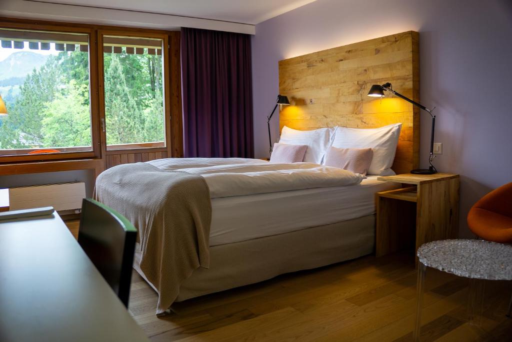 Voodi või voodid majutusasutuse Wellness Hotel Stoos toas