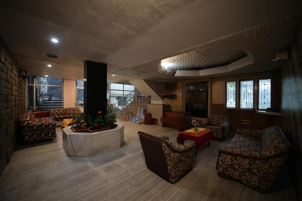 Uma área de estar em Jayaraj Residency