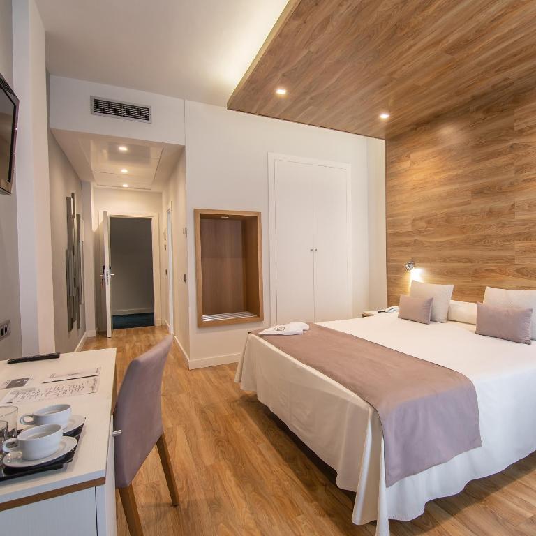 Postel nebo postele na pokoji v ubytování Hotel Monte Puertatierra