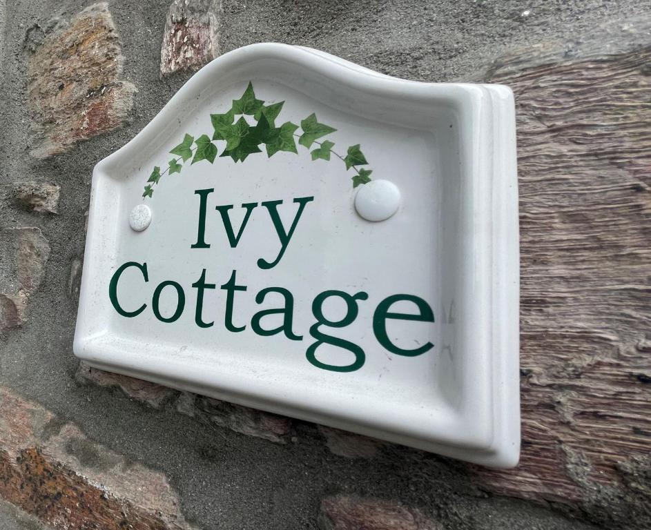 a ivy cottage sign on the side of the street at Ivy Cottage, in Lostwithiel