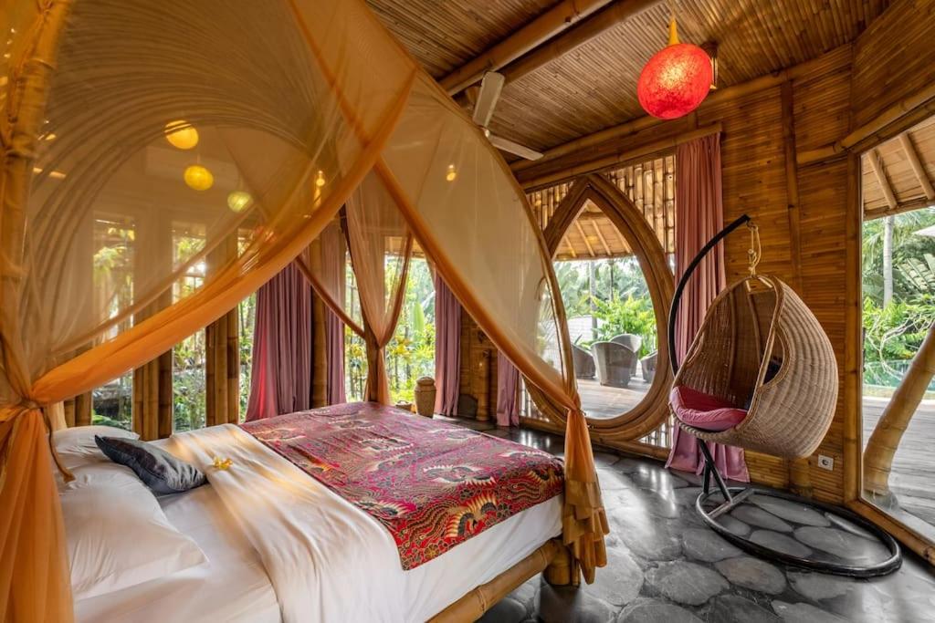 Letto o letti in una camera di Harmony House, Bamboo House with Pool view