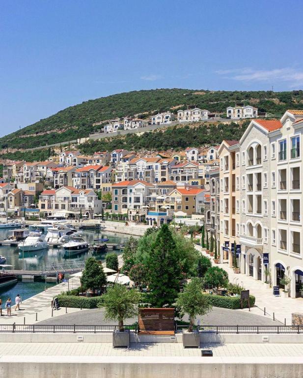 a view of a city with buildings and a harbor at Lustica Bay Centrale Sparcle in Tivat