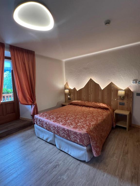 Postel nebo postele na pokoji v ubytování Hotel Des Glaciers