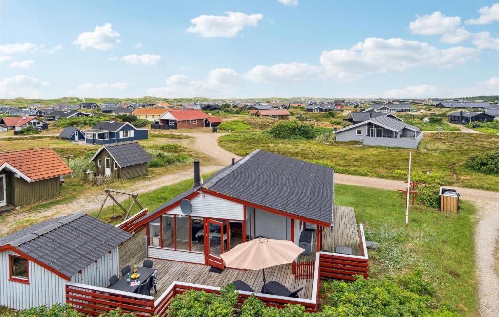 an aerial view of a house with an umbrella at Beautiful Home In Hvide Sande With 2 Bedrooms And Wifi in Bjerregård